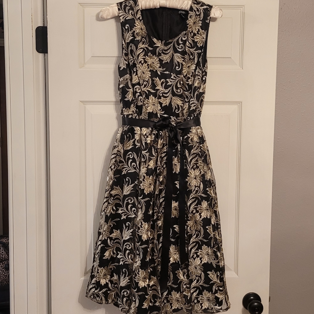 Elegant black and gold dress with shimmering stitching by Roz & Ali size 4